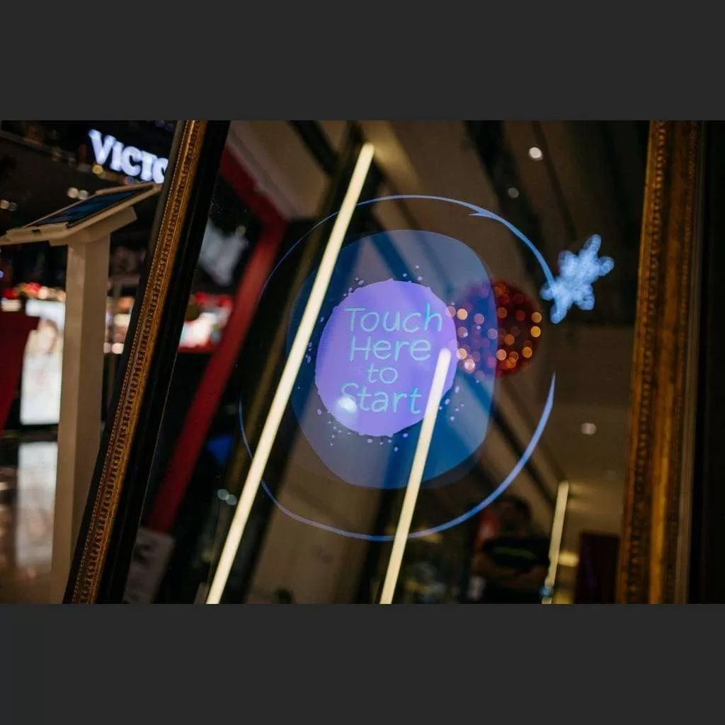 Interactive touch display on the framed Mirror Photobooth