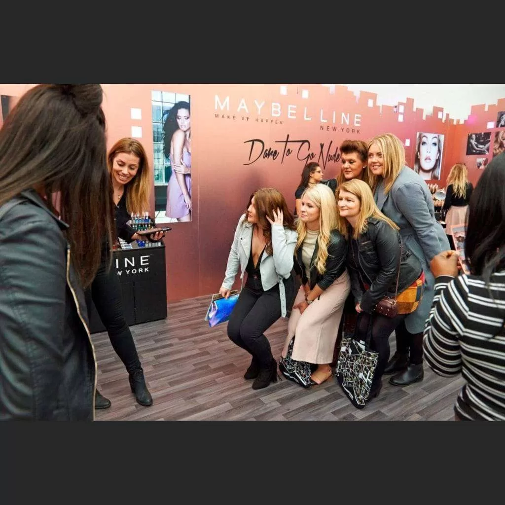 Group enjoying a Mirror Photobooth brand activation